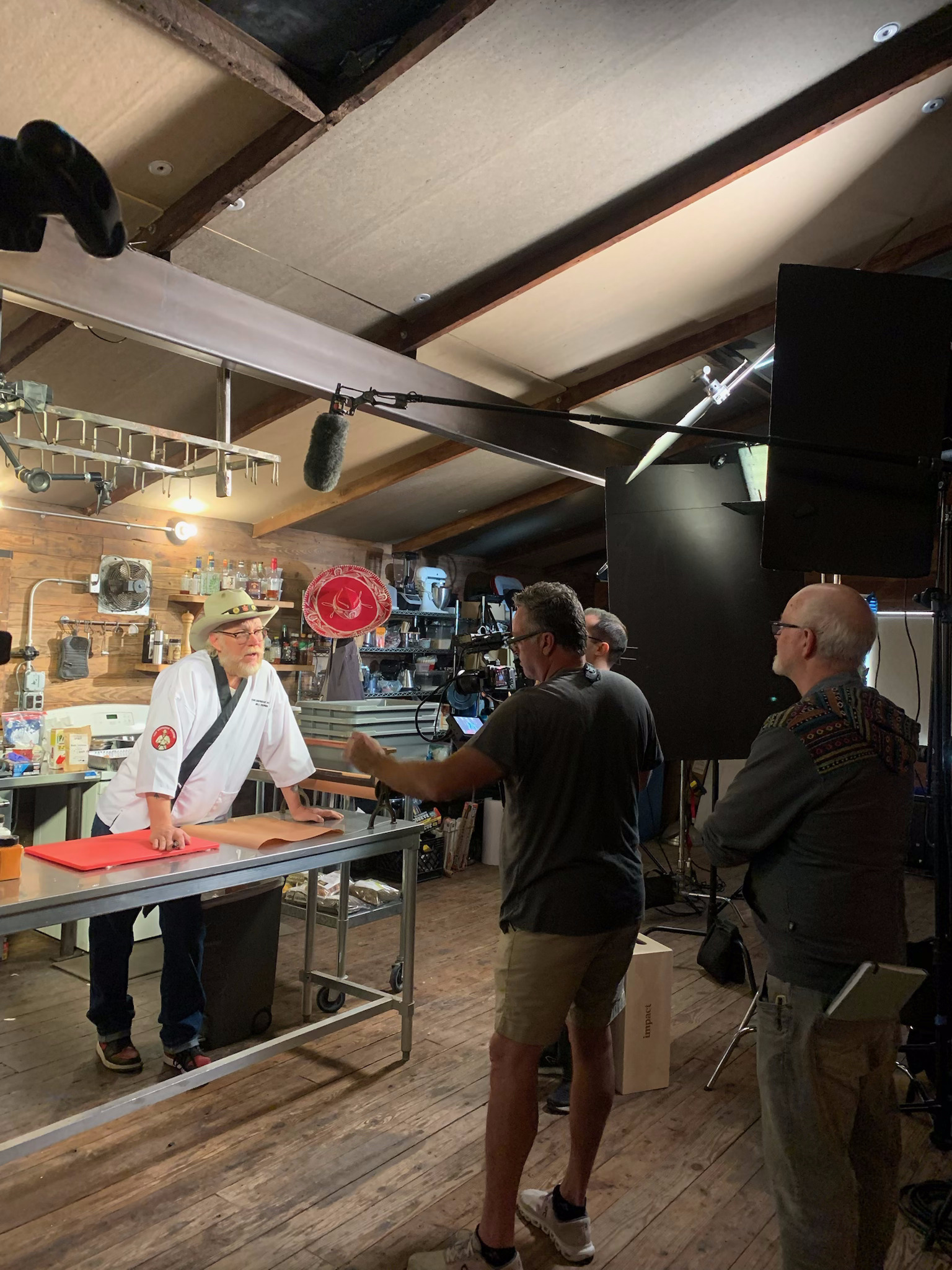 Director working with talent on the set of Sausage Sensei