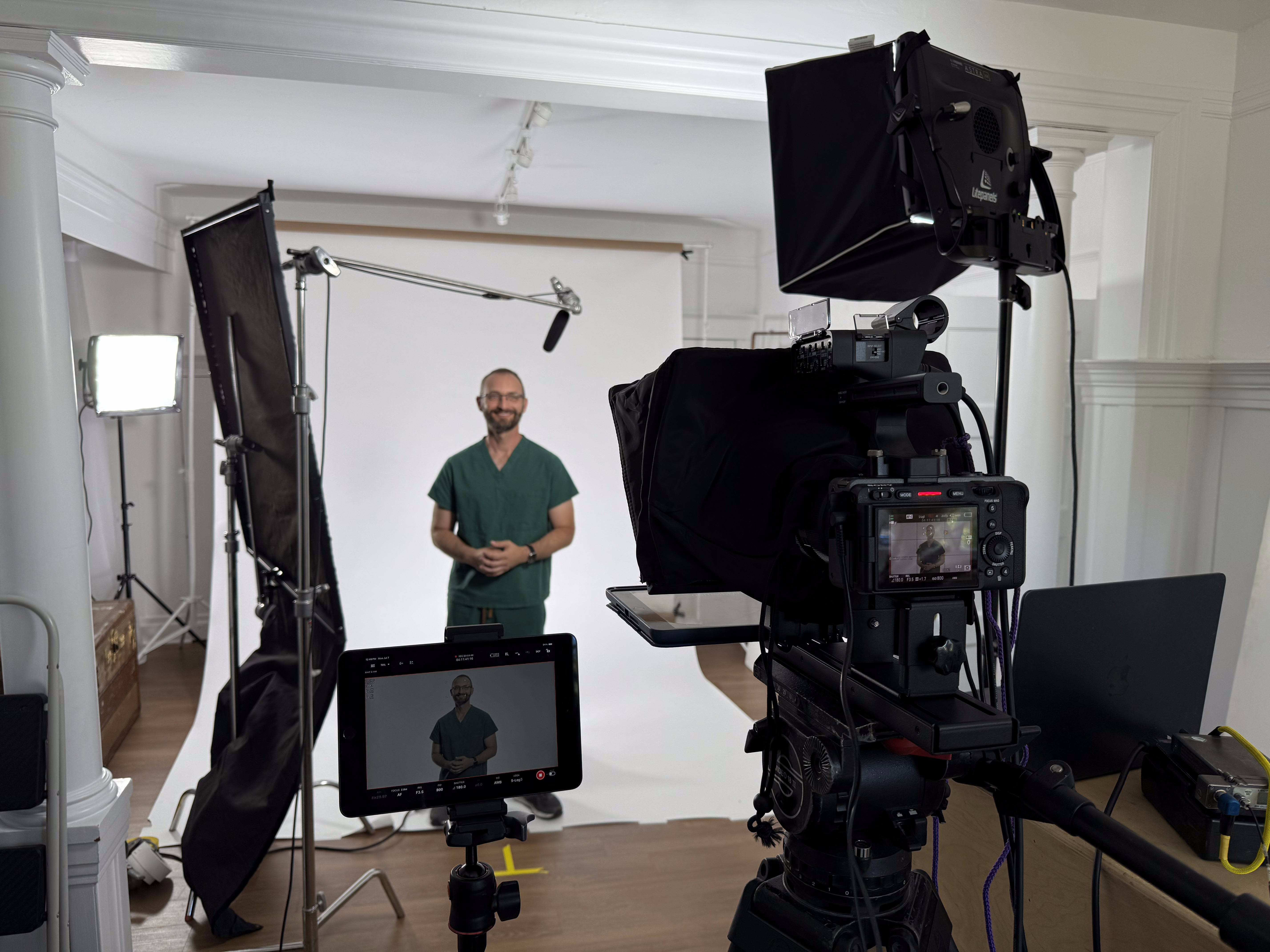 Studio interview setup with camera, monitors, and lighting for a nonprofit shoot