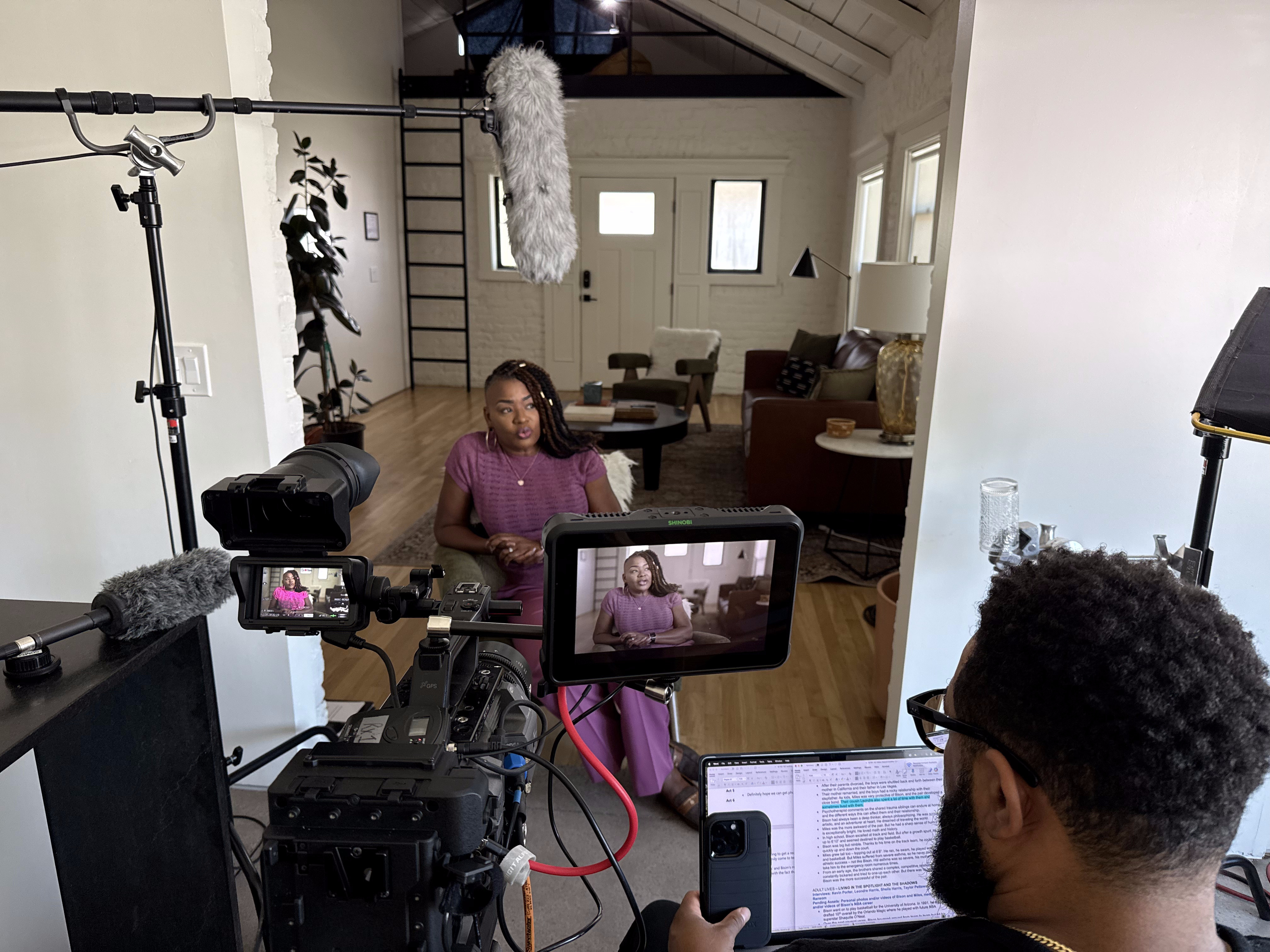 Full production crew filming an interview