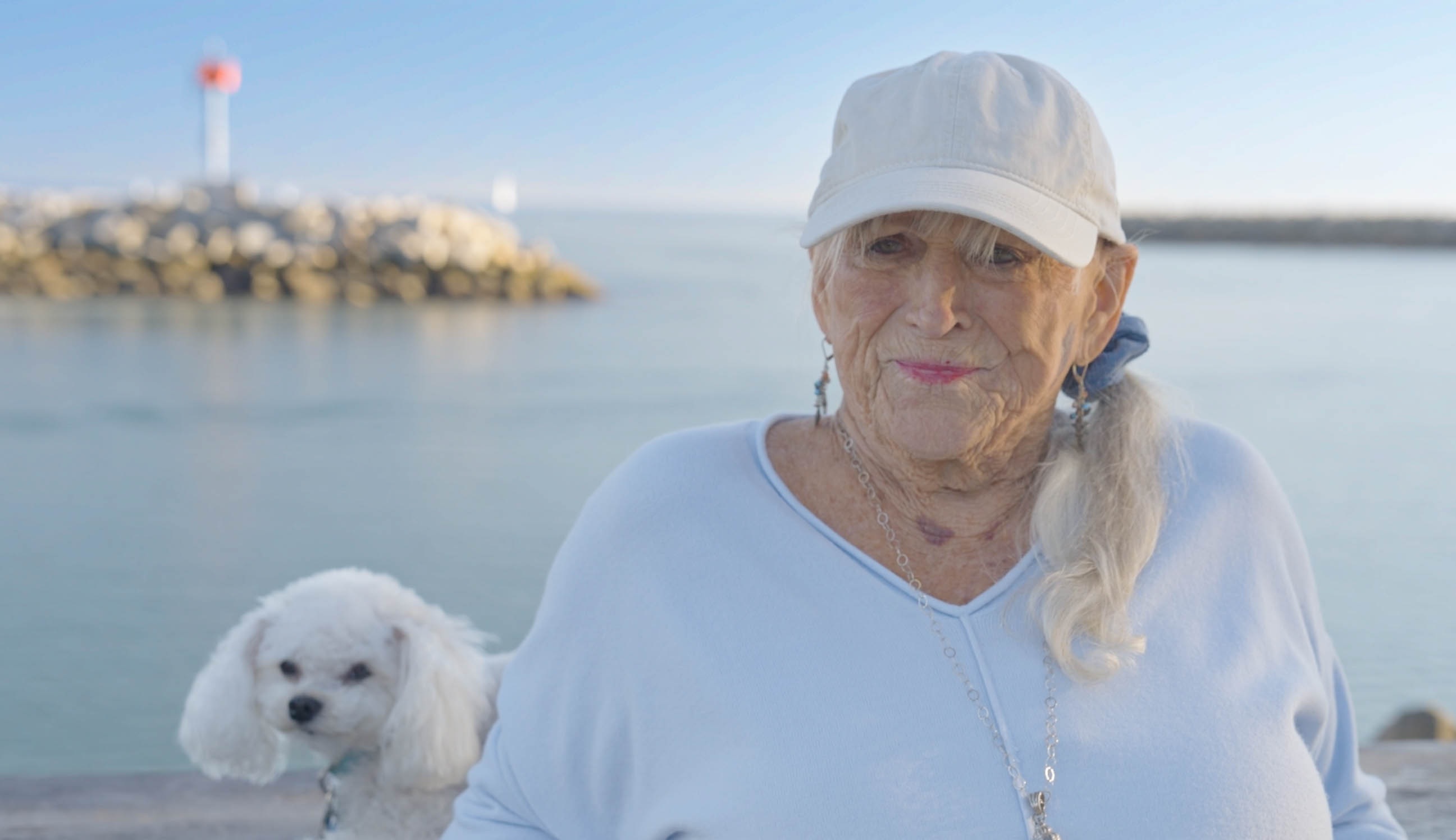 Woman with her dog on a pier, from an in-progress family legacy documentary
