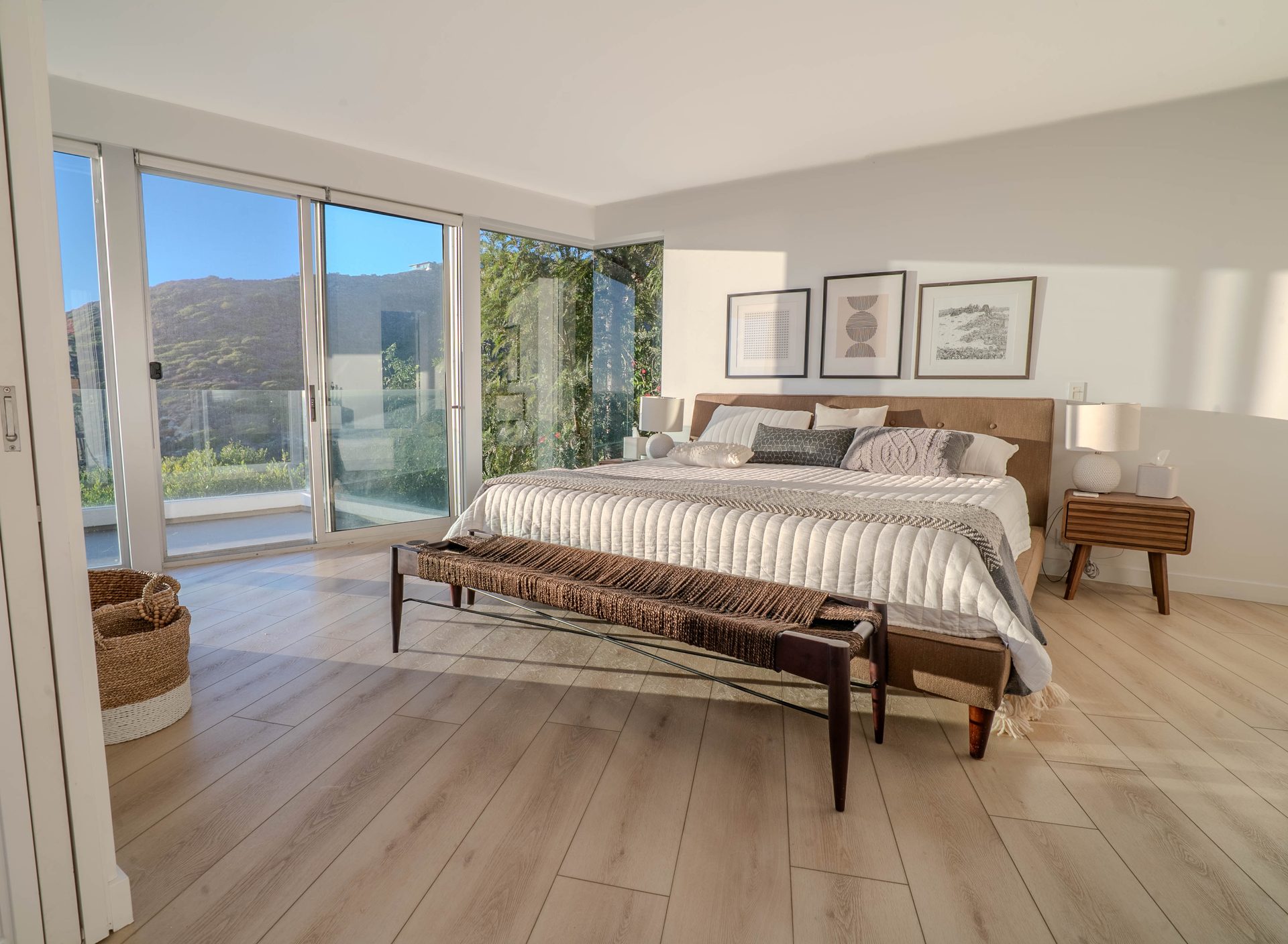 Primary bedroom with king bed and corner ocean-view windows