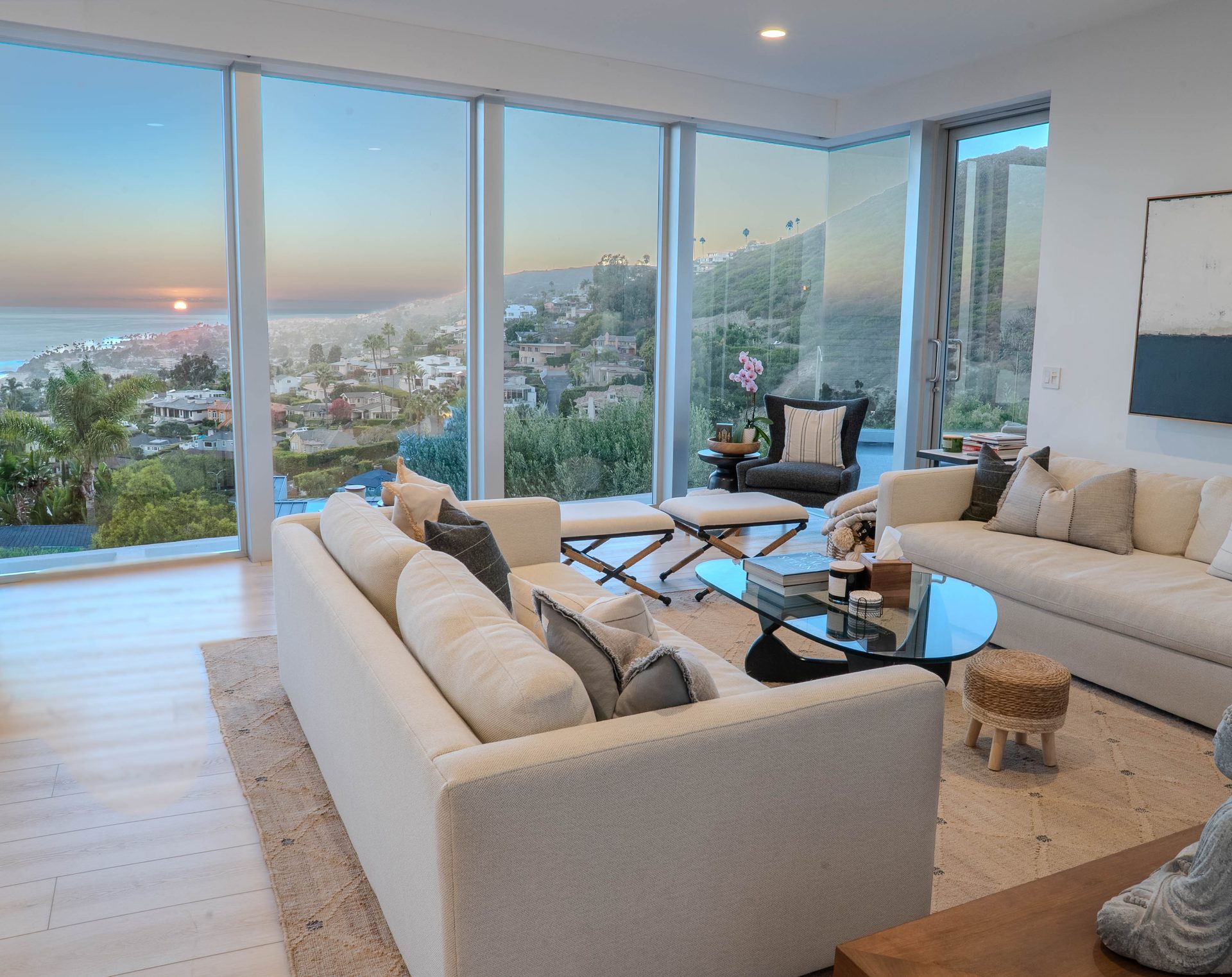 Living room with panoramic sunset ocean view