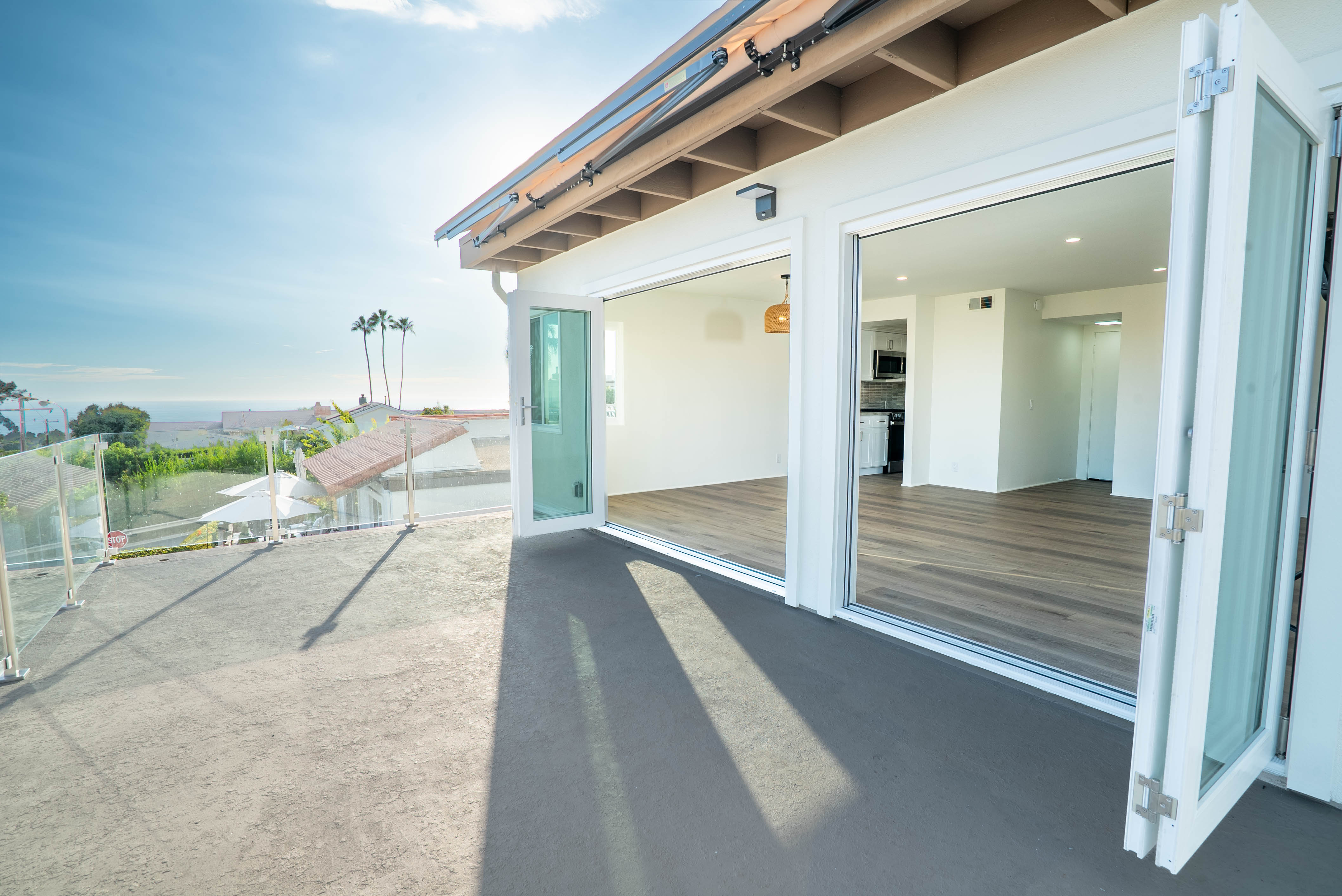 Rooftop patio with retractable awning opening into the living room